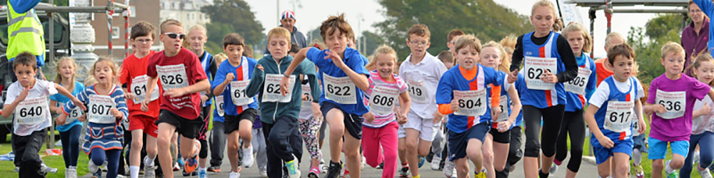 Children taking part in Folkestone Rotary Half Marathon in 2013 on The Leas in Folkestone, Kent.