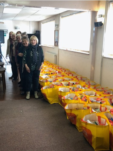 Ladies from the Inner Wheel Club with some of the Christmas parcels they packed in 2019